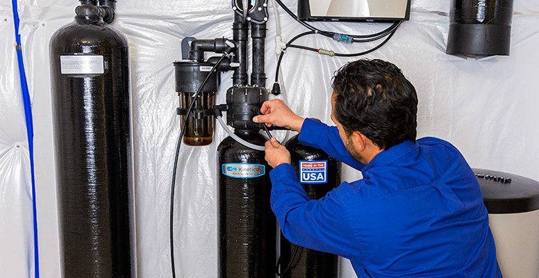 Technician Installing Water Softener