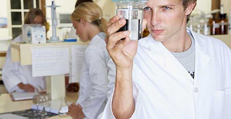 Laboratory Technician with Water Sample