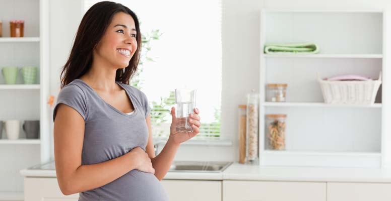 Pregnant woman drinking water