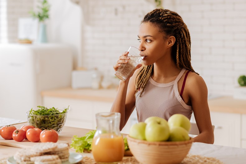 Woman Drinking Water W/ Produce