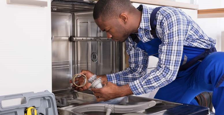 Man fixing dishwasher