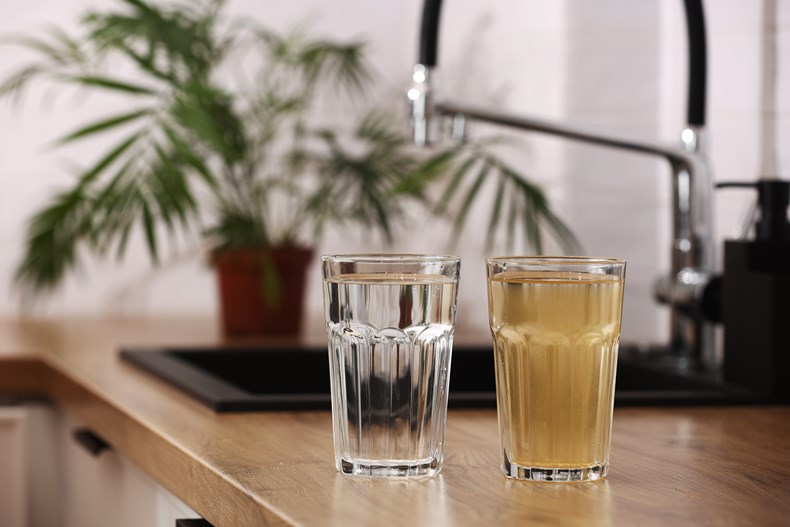 Glass of clear water and glass of cloudy water